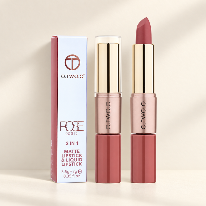 Rose-gold dual-ended lipstick tubes with original product box on ivory surface