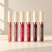 Six matte lip gloss tubes with ivory caps in nude pink red and brown shades