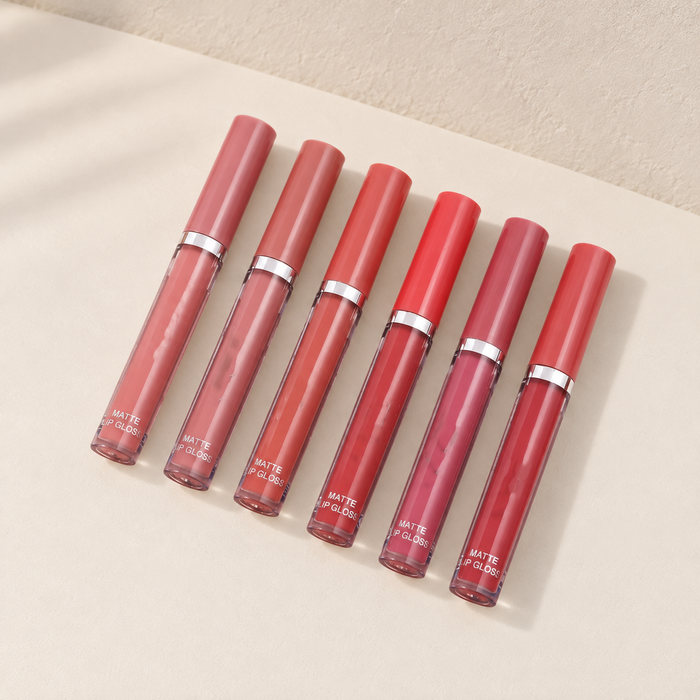 Six matte lip gloss tubes with matching caps and silver bands