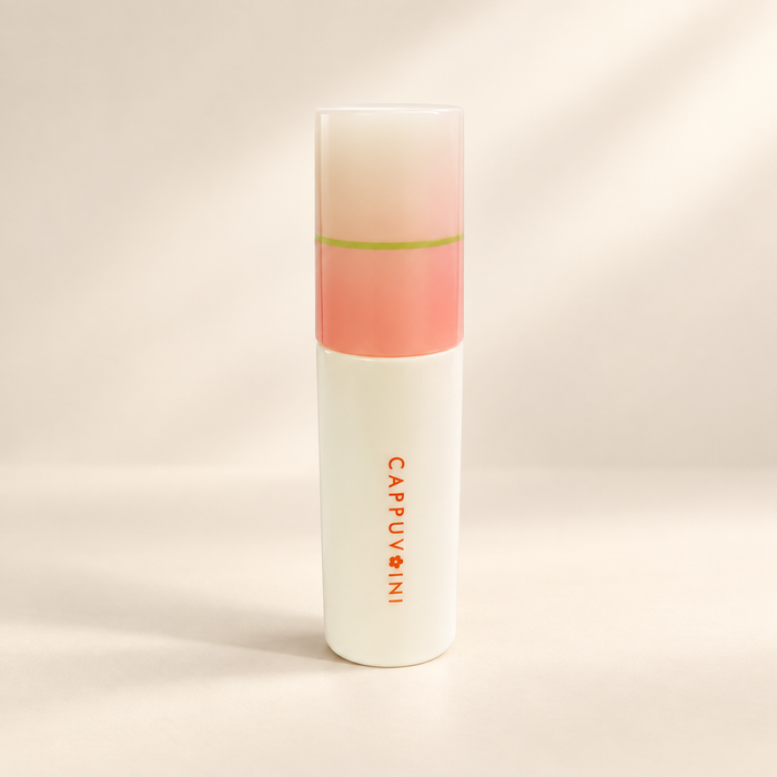 Ivory lipstick tube with peach cap and orange lettering