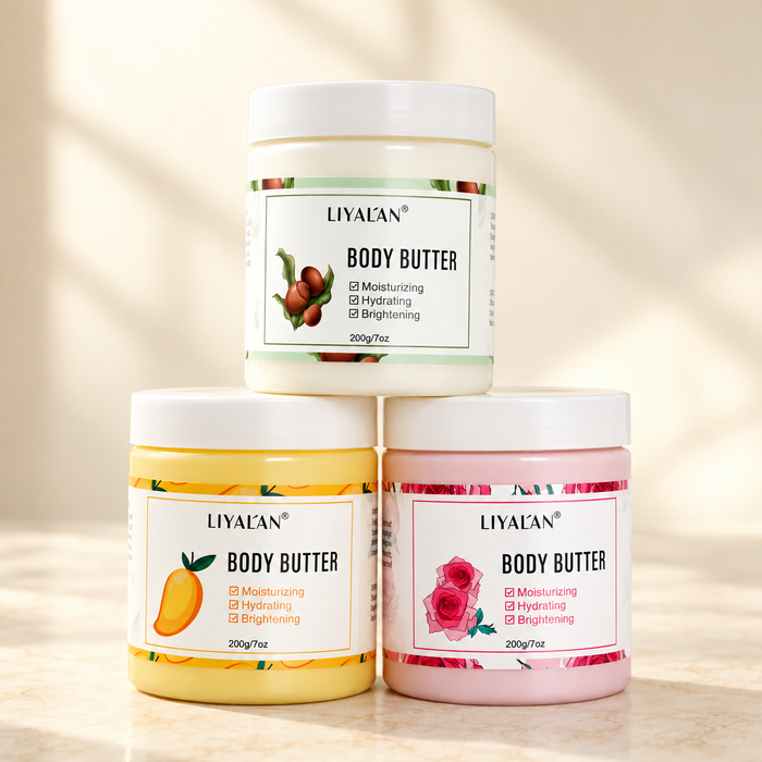 Three body butter jars in cream yellow and pink stacked on ivory