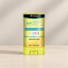 Yellow skincare stick with its original printed label on ivory
