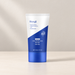 White and blue Hoygi skincare tube standing on its blue cap