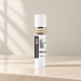White West Month cylinder with beige and black label on ivory vanity
