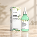OUHOE jasmine serum bottle and floral white box on ivory surface