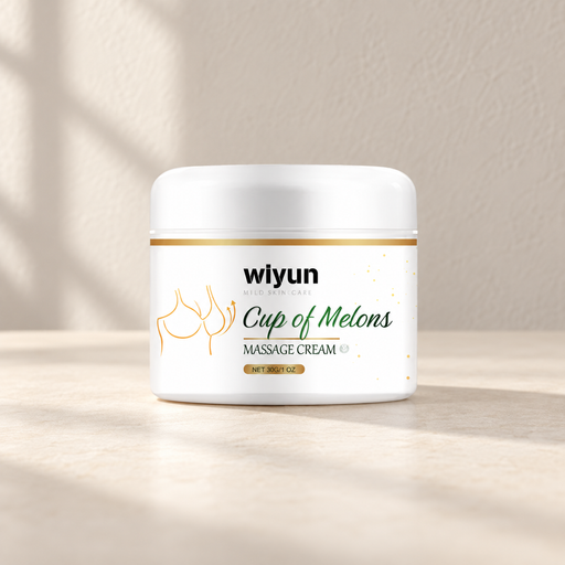 White cream jar with green lettering and gold details on an ivory surface.