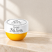 Yellow OceAura jar with white lid on ivory vanity
