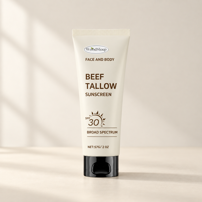 Ivory sunscreen tube with a black cap on an ivory surface.