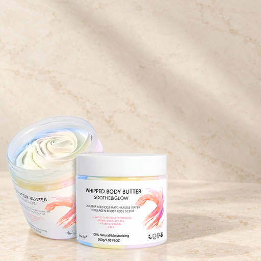 Body butter shown in open and closed views on a warm ivory stone surface.