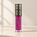 Purple Dragon Ranee tube with black and gold patterned cap on ivory vanity