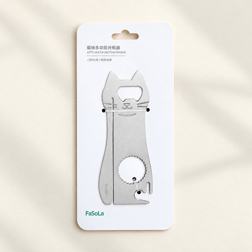 Stainless steel cat-shaped opener secured to its white retail card on an ivory surface.