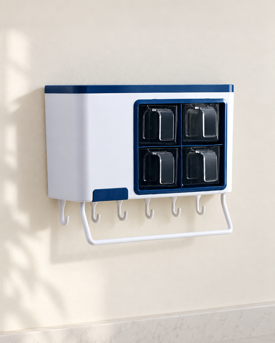 White and navy four-bin seasoning organizer on an ivory kitchen wall.