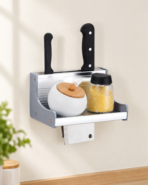 Compact silver kitchen wall rack holding jars and knives.