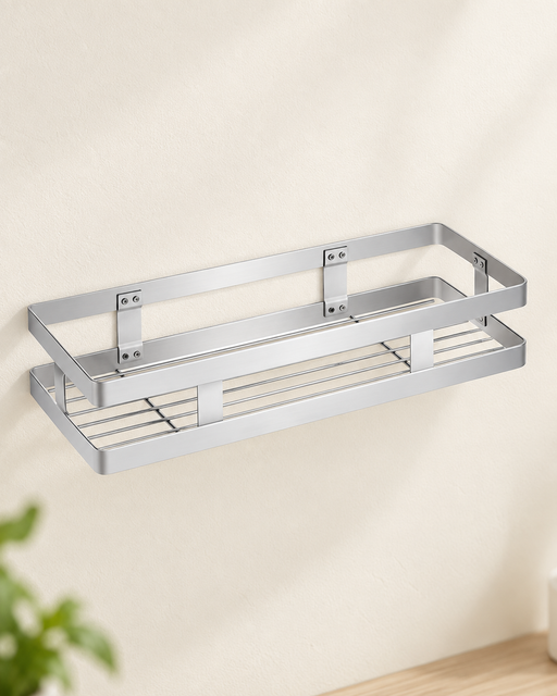 Empty silver rectangular wall basket mounted on an ivory kitchen wall.