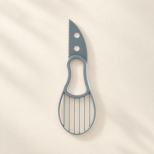 Grey-blue avocado slicing tool with serrated edge and oval grid on an ivory surface.