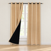 Beige curtains with black lining displayed around a window