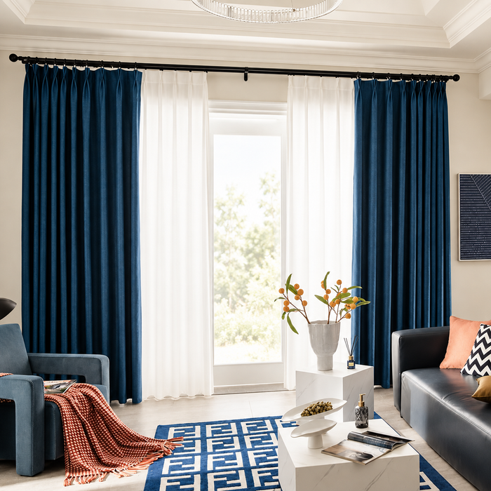 Dark teal curtains in a softly lit sitting room
