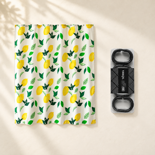 Lemon-print shower curtain and packaged black rings on an ivory surface.