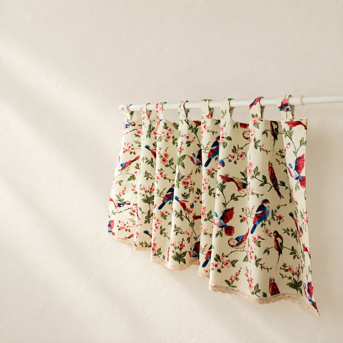 Ivory bird and floral cafe curtain on a white rod
