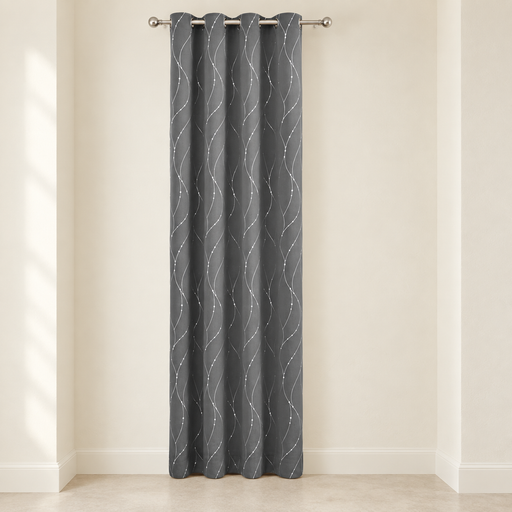 Grey grommet curtain panel with white wavy dotted lines in an ivory alcove.