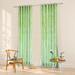 Pale green botanical sheer curtains with willow-leaf print in a neutral room.