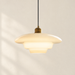 Ivory glass pendant light with stepped shade and brass cap.