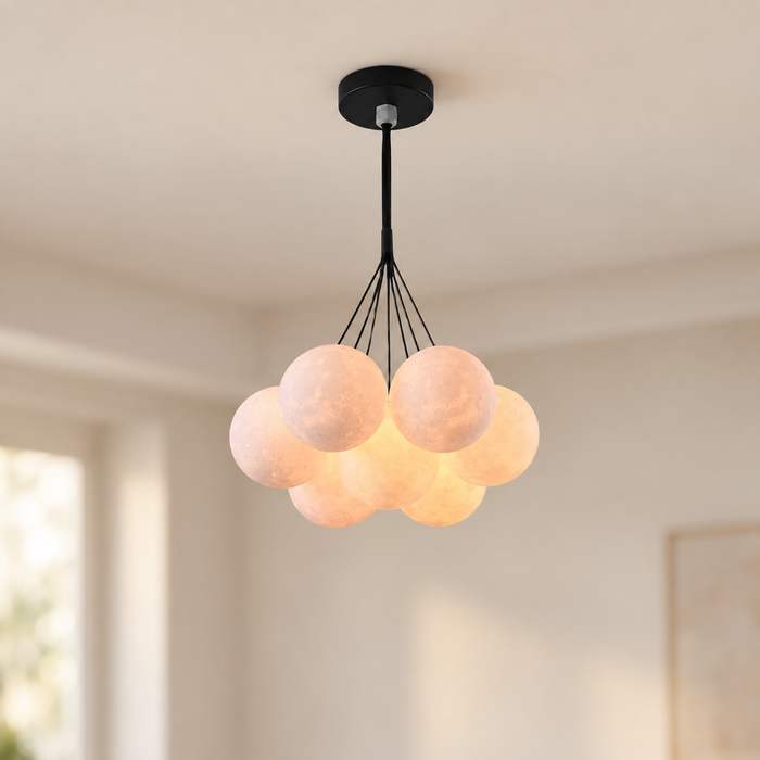 Seven globe moon pendant with black suspension in a neutral interior