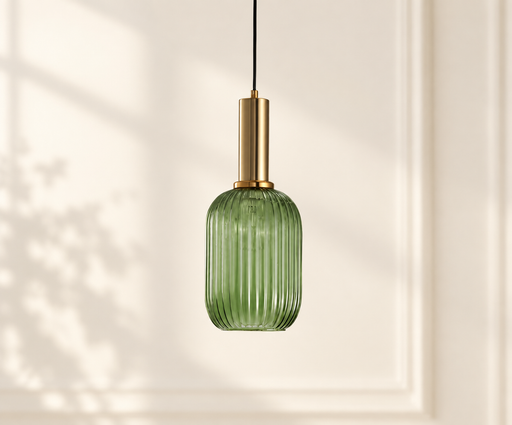 Green ribbed glass pendant light with a gold cylindrical holder against an ivory wall.
