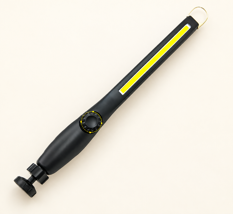 Black inspection light with a yellow strip, hanging loop and adjustable round base