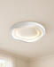 White ceiling light with a warm recessed glow in an ivory room.