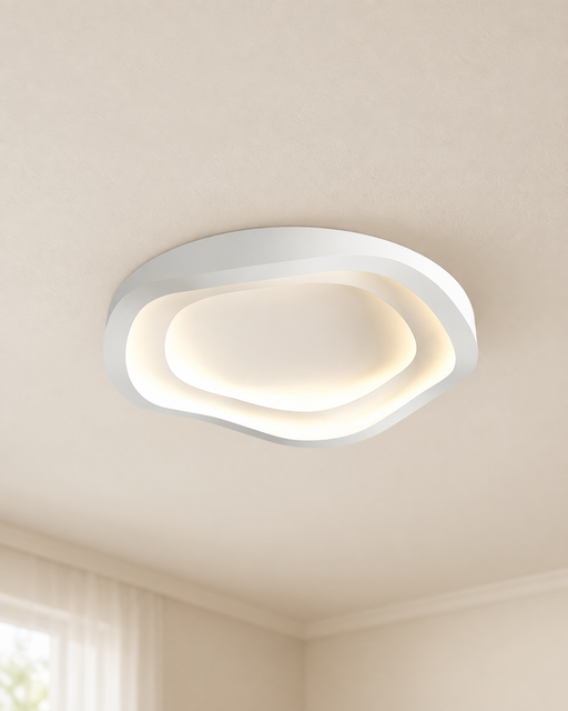 White ceiling light with a warm recessed glow in an ivory room.