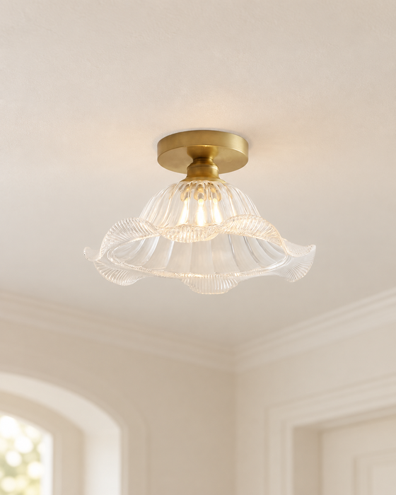 Brass and fluted glass ceiling lamp in an ivory entryway.