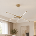 Gold linear chandelier in an ivory living room