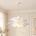 White floral pendant light with layered petals mounted in an ivory interior.