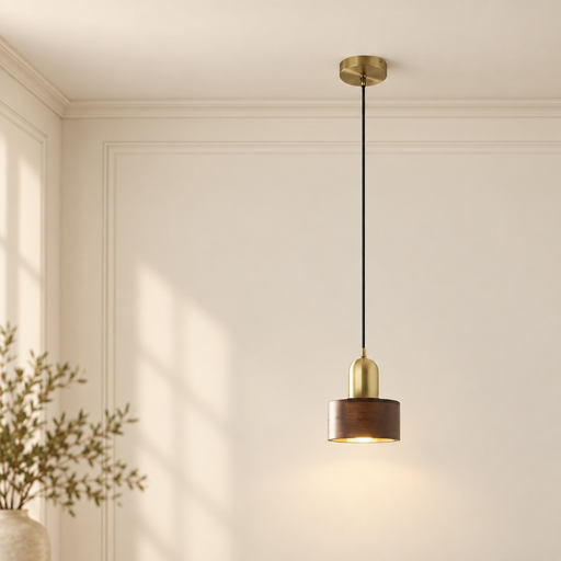 Walnut and brass pendant lamp with black cord in an ivory interior.