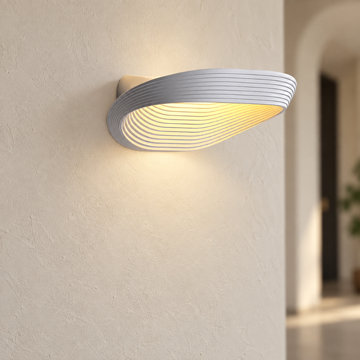 White oval wall lamp illuminating an ivory wall.