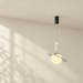 Ivory planet-shaped pendant lamp suspended from a black ceiling canopy