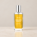 Roxelis fragrance spray bottle on an ivory vanity