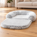 Light grey plush pet sofa bed on a wooden living-room floor.