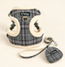 Grey plaid pet harness leash and pouch on ivory background