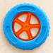 Blue and orange floating dog wheel toy on ivory stone