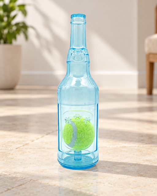 Translucent blue bottle-shaped dog toy with a green ball inside, standing on a pale stone floor.