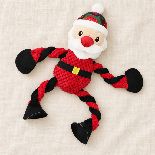 Santa-shaped rope dog toy with red and black limbs on ivory linen