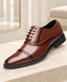 Brown Oxford dress shoe with perforated seams and five lace passes on a pale stone bench.