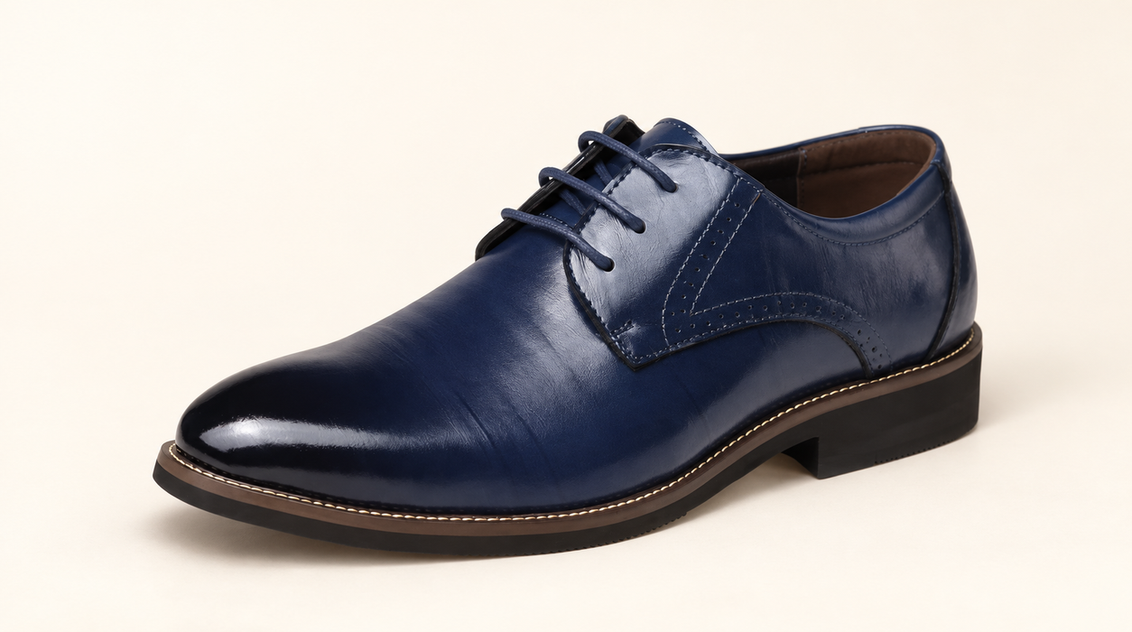 Navy formal lace-up shoe on warm ivory surface