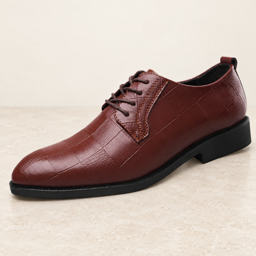 Burgundy embossed lace-up shoe on an ivory stone surface