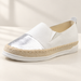 White slip-on loafer with a silver toe panel and woven midsole