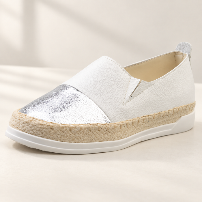 White slip-on loafer with a silver toe panel and woven midsole