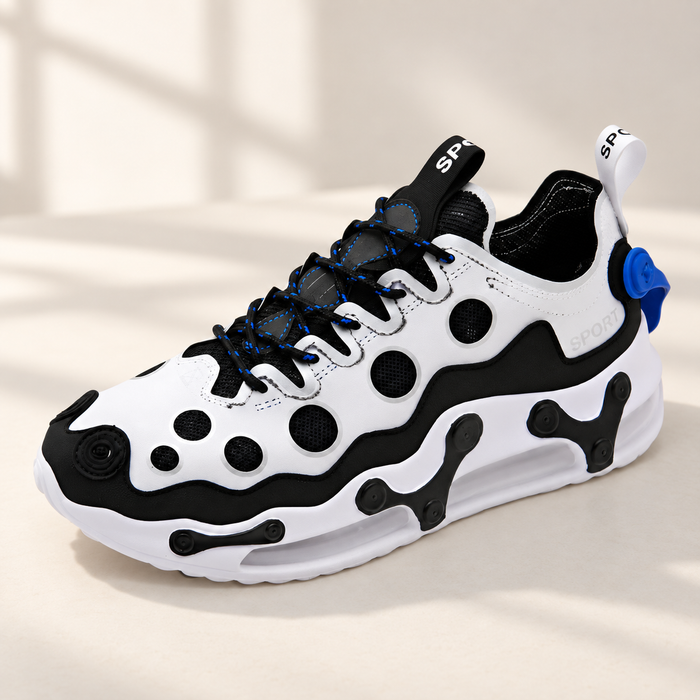 White and black athletic shoe with circular mesh details and blue accents