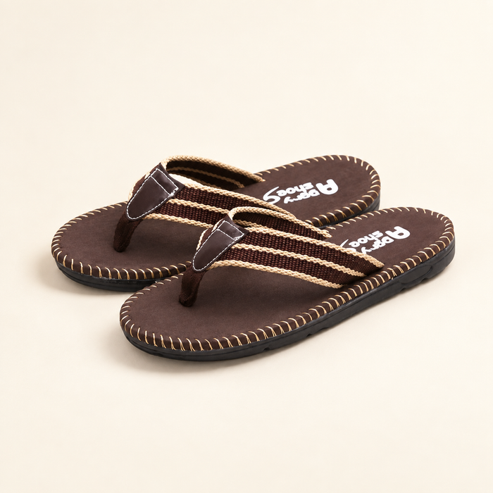 Brown woven-strap flip-flops on ivory surface